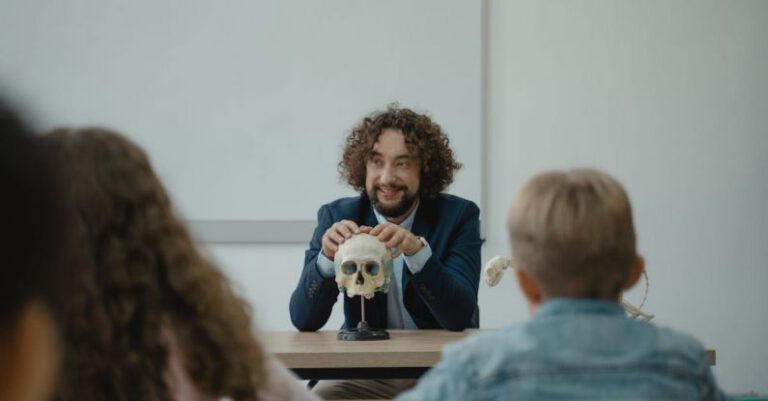 Learning - Teacher Showing His Class a Human Skull