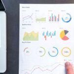 Data Analytics - Person Holding Chart And Bar Graph