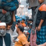 Market Conditions - People walking on busy street in Asia