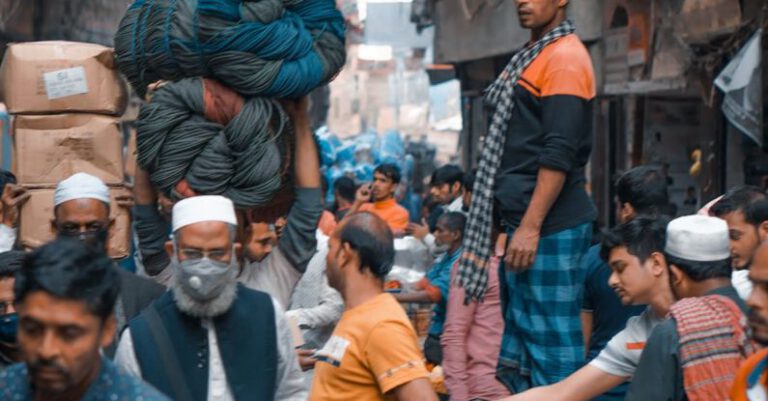 Market Conditions - People walking on busy street in Asia