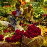 Market Disruptions - Men Preparing Bouquets on Marker