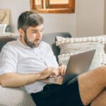 Remote Work - A Man Using a Laptop