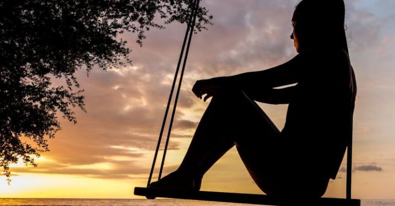 Thinking - Silhouette of Woman on Swing during Golden Hour