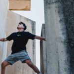 Scaling - Man Climbing a Building