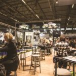 Networking - People Inside a Cafe With Tables and Chairs