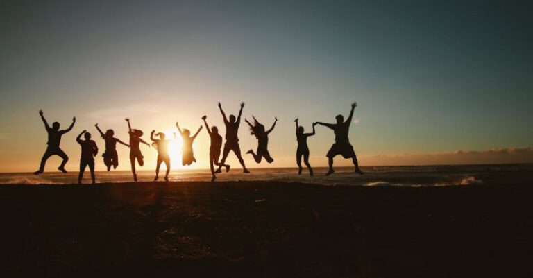 Teams - Silhouette Photography of Group of People Jumping during Golden Time